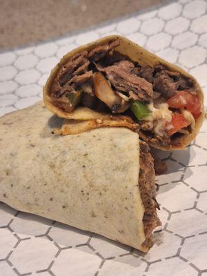 Our delicious perfectly seasoned Steak, Green Peppers, Red Onions, Jalapeños, Tomato, American Cheese, Mushrooms, and A1 wrapped in a Garlic