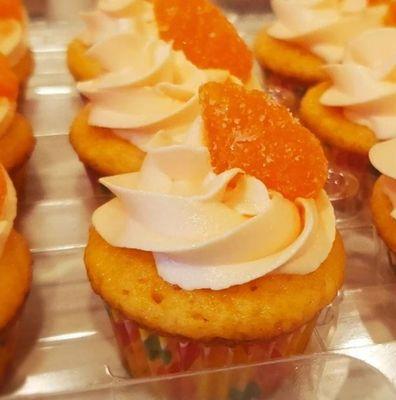 Orange Dreamsicle :orange cupcake with a vanilla champagne buttercream frosting topped with a candied orange