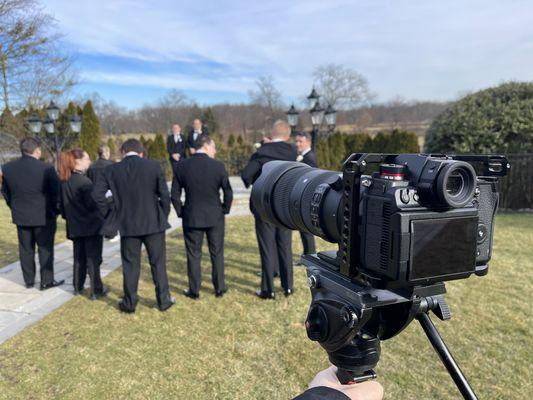 Behind the scenes of forever: Groomsmen in action, moments before "I do."