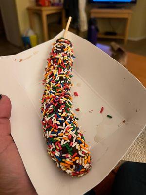 Choc. Dipped banana w/ Rainbow Sprinkles. Yummy!!