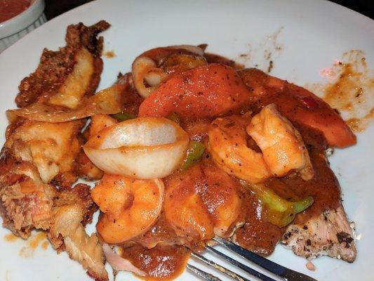 Riverman Seaside Pan Seared Salmon topped with succulent shrimp with a flavorful spicy sauce.