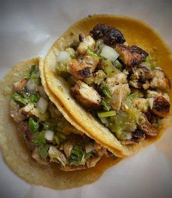 Grilled Chicken served on a Hand-Pressed Corn Tortilla with Cilantro, Onion, and Salsa Verde.