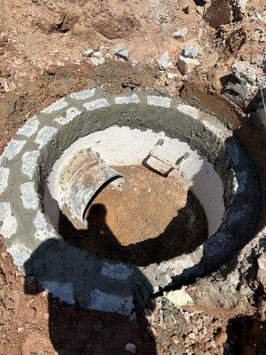 Manhole stucco and stone cap