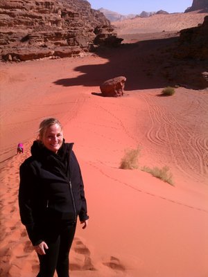 Dune sledding in the red sands of Wadi Rum.