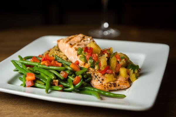 Hawaiian Salmon: Fresh grilled Salmon topped with sweet pineapple salsa served with 2 sides.