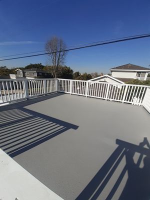 Roof deck waterproofing with orange peel texture finish