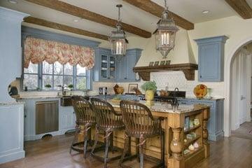 Kitchen with Island and Beams by The Holmes Builders