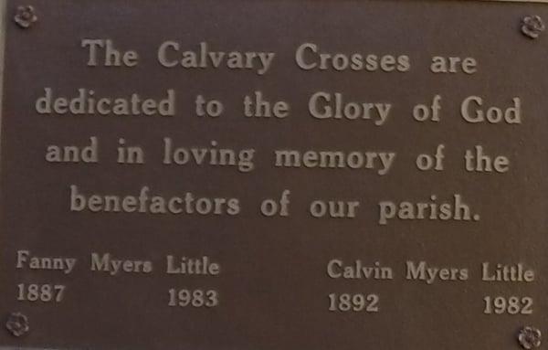 Calvary Crosses plaque in garden