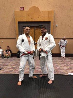 Jorge Pereira (Coral Belt) and his master Rickson Gracie (red belt). Legends!!!