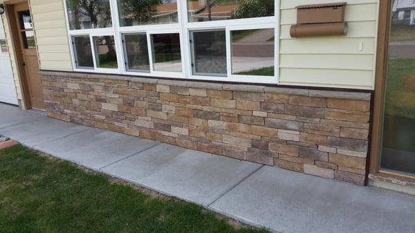 We weather proofed the wainscot and installed clip stone which is a screw on product. afterwards we made a custom wood piece ...