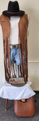 Take a look at this beautiful fringed vest,add this piece to just about anything !