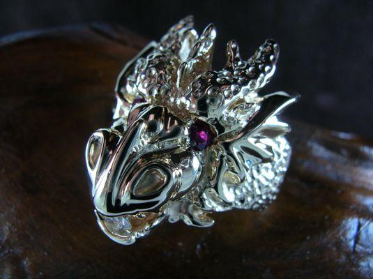 Finished Dragon ring with rubies and diamonds set, top angle view.