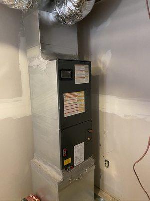 Installation of a 3 ton Goodman Air handler in the basement of a 3 story home