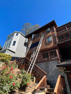 Exterior siding prepped and coated a stain and sealer