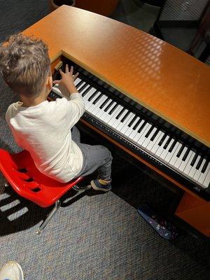 Tickling the ivories at the Science Spectrum.