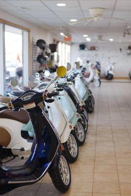 Various Vespa models in our showroom.