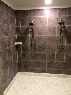 Shower overhaul- tile replacement with crown moulding and marble skirting replaced an old, stained porcelain floor. Love it!