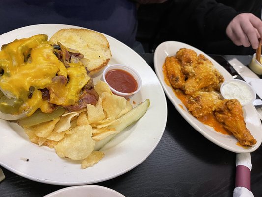 Pitt beef sandwhich with all the add ons and 6 hot garlic parm wings