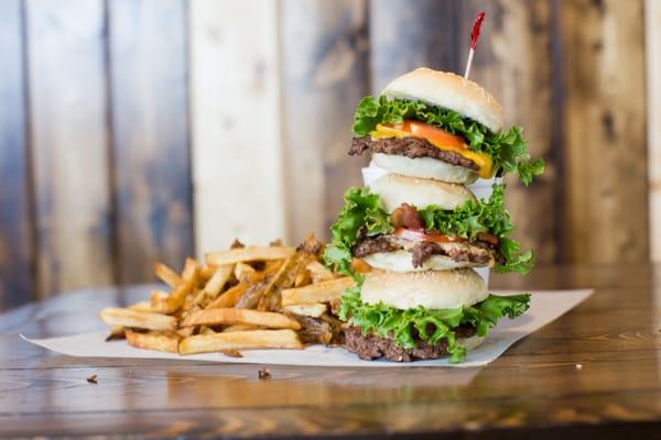 Sliders are 2 ounce patties with all the toppings. Cheese, lettuce, tomato, burg sauce. Optional add ons are pickles, grilled onions& bacon.