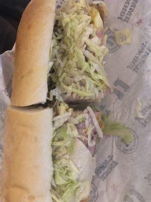 Turkey, ham,peppers pickles lettuce tomato cheese onions mayo mustard. I'm so sad that the Jimmy mustard is gone