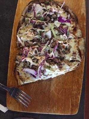 Pulled pork flatbread! Really good sauce and the cabbage slaw added a great taste! Like a less heavy pulled pork sandwich on flatbread!