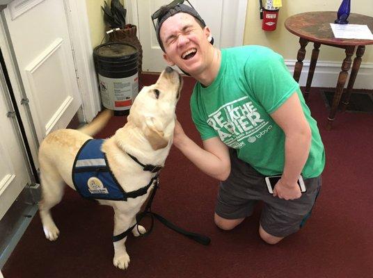 Guide-dog-in-training Jules is making a PCS teen very happy. The synagogue community plays an integral role in raising future guide dogs.