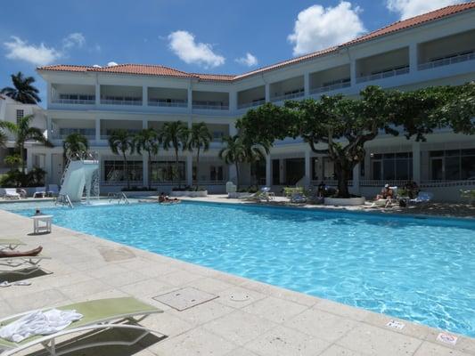 The main pool at Couples Tower Isle. Renovated in 2008 the classic high dive has been converted into a cascading water fall.