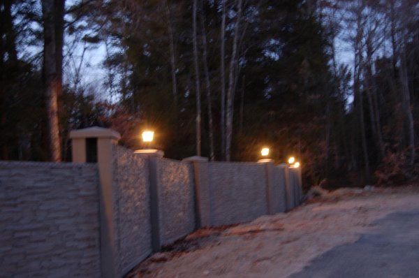 Lights on our Stone tree concrete fence system.