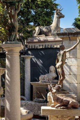 Columns carved stone , statuary garden landscape , deer , chateaux de raray