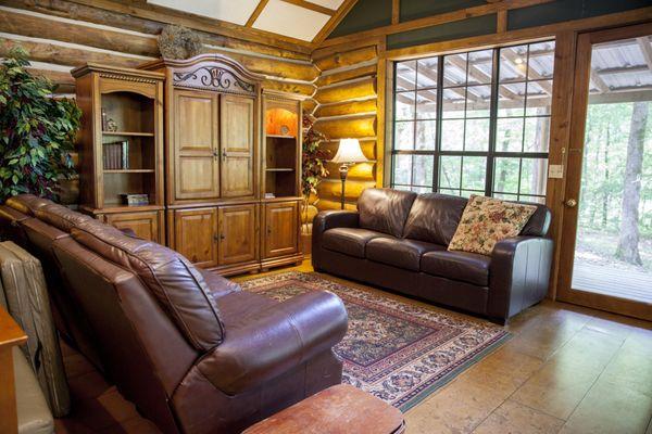 Antlers Log Cabin has a large living room with ample seating and table space for a large group.