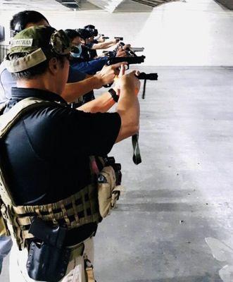 Students learned how to use a flashlight while shooting a handgun.