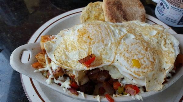 Crock of the day : sausage, tomato, onions, peppers and potatoes w two eggs on top.