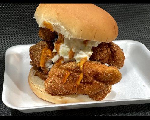 Fried fish sandwich with coleslaw and fish sauce