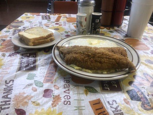 Two whiting fillets, scrambled eggs with cheese, grits, and toast on the side. I needed a nap after I ate this good meal!!!