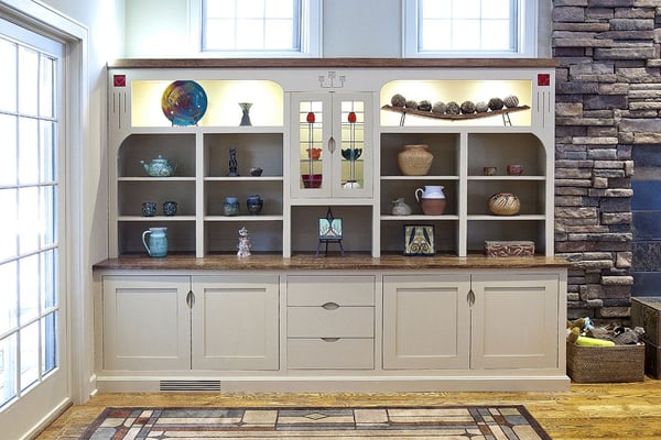 Custom cabinet by Terry Hanover features leaded glass and carvings.