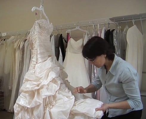 Wedding gowns carefully inspected