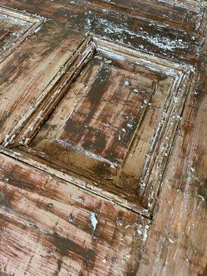 Refinishing 100 year old door out of St Louis to convert to a large dining table for guests at Hermann Grain Bins Bed & Breakfast