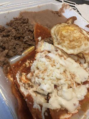 Chilaquiles with a side beans and carne asada