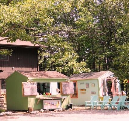 It's the little building far right, part of Sleeping Bear Market complex with Glen Arbor Shave Ice and Reel Tales Fishing Charters