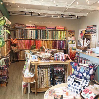 Shop interior with the main wall of fabrics