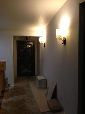 Added sconces in the entryway- cool touch