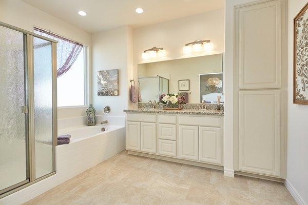 Lovely master bathroom with soaking tub, walk in shower, and substantial storage.