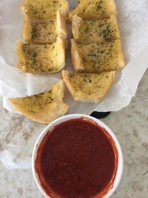 Garlic bread and marinara sauce.