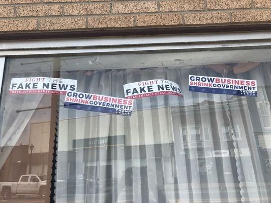 Pro-Trump stickers plastered all over business window.