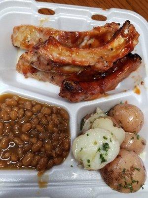 4 ribs with parsley potatoes and baked beans ($13)