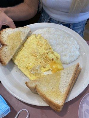 Cheese omelet with grits and toast