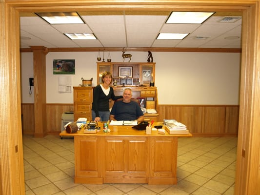 Owner and secretary at custom business office.