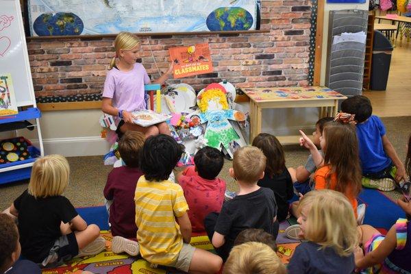 We love when alumni come back to read to our Kindergarten class.