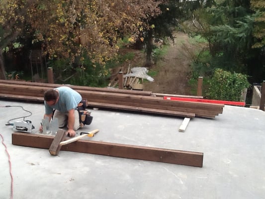 Here's contractor Chris Perko framing new deck.  Great work ethic, knows his stuff.