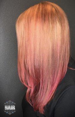 Peachy coral hair color.